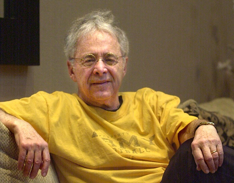 In this Dec. 20, 2002, file photo, Chuck Barris, the man behind TV's "The Dating Game," poses in the lobby of his apartment in New York. Game show impresario Barris has died at 87. Barris, the madcap producer of "The Gong Show" and "The Dating Game," died of natural causes Tuesday afternoon, March 21, 2017, at his home in Palisades, New York. (AP Photo/Bebeto Matthews, File)