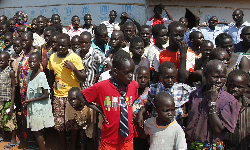 
              FILE - In this Monday, Aug. 29, 2016 file photo, refugees wait for U.N. High Commissioner for Refugees Filippo Grandi to arrive at a transit center for South Sudanese refugees in the remote northwestern district of Adjumani, near the border with South Sudan, in Uganda. Uganda is at a "breaking point" as almost 3,000 South Sudanese refugees pour into the country every day, the United Nations refugee chief said Thursday, March 23, 2017. (AP Photo/Stephen Wandera, File)
            