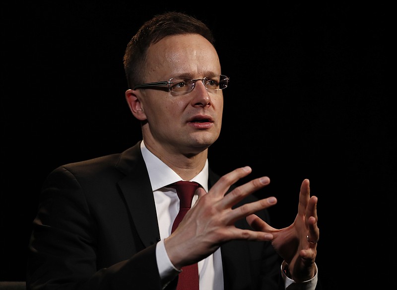 
              Hungarian Minister of Foreign Affairs and Trade, Peter Szijjarto, speaks during an interview at the Associated Press bureau in Washington, Wednesday, March 22, 2017. Hungary’s government built a fence along its southern border, boasts about making Europe great again and says political correctness can’t interfere with fighting terrorism. It’s a country made for an alliance with President Donald Trump. And its top diplomat is excitedly meeting officials across Washington this week to discuss closer political, economic and military cooperation, and not the U.S. charges of democratic backsliding in Hungary that largely defined the relationship in recent years.(AP Photo/Carolyn Kaster)
            