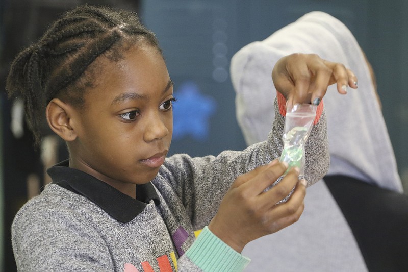 Sy'Taishia Eberhardt assembles a "plant cell" in a Hamilton County fourth-grade classroom earlier this year.