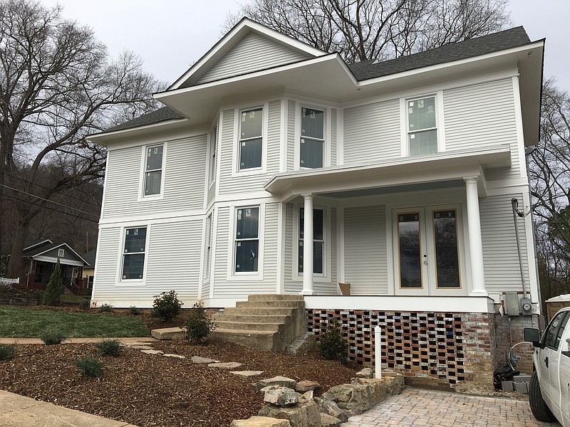 A side view of the restored home as seen from 54th Street.