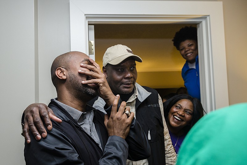 Anthony Byrd, left, is overcome with joy at his victory over incumbent City Councilman Moses Freeman in the Chattanooga municipal election on March 7.