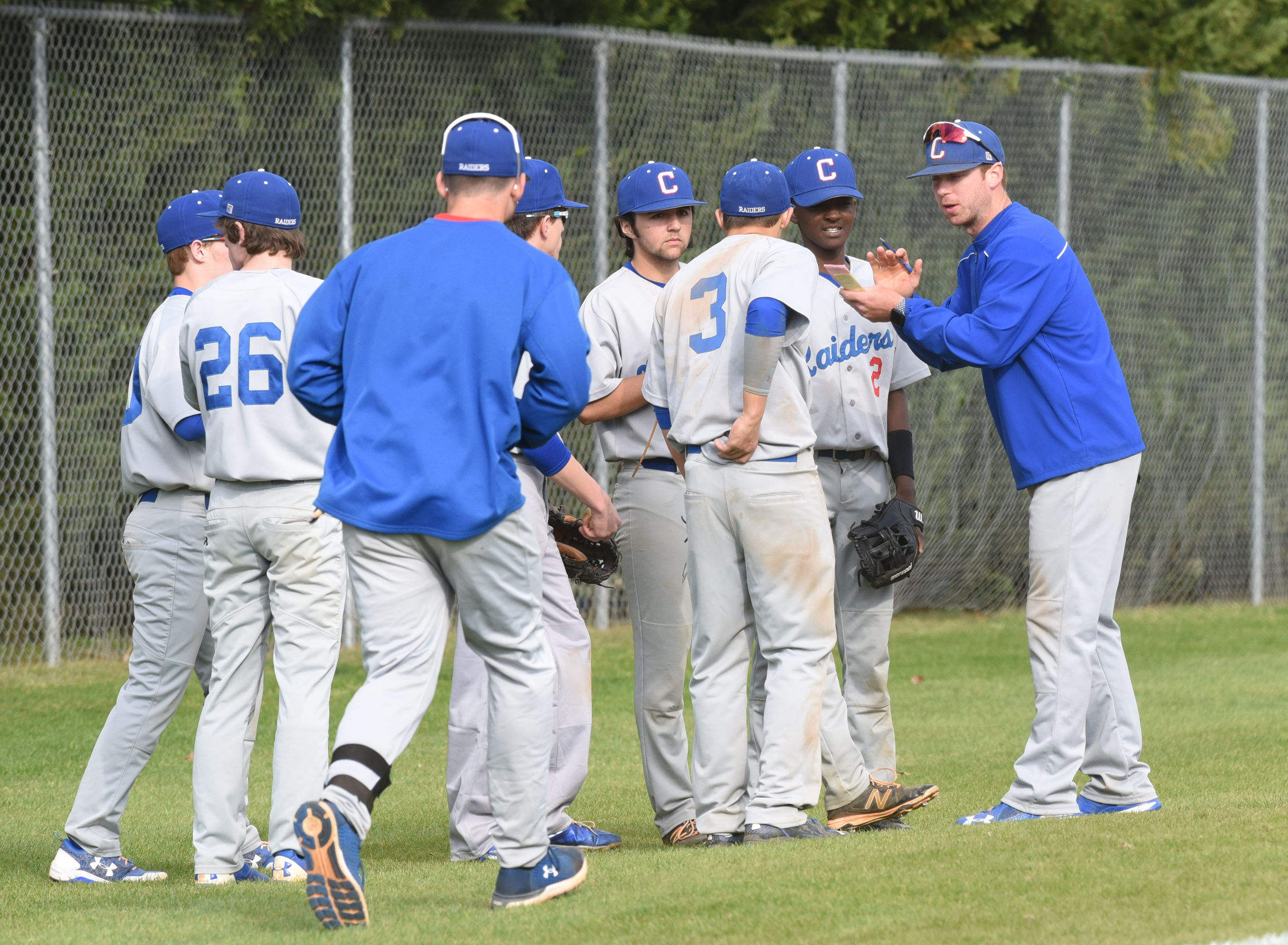 Cleveland coach Preston Scoggins, right, applauds his teams efforts after 7-runs, in five innings at Central on Thursday.