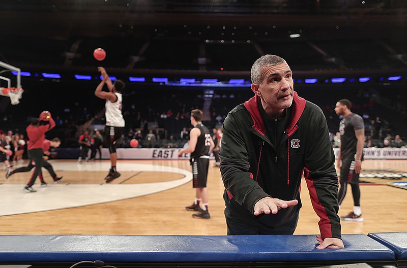South Carolina head coach Frank Martin talks with members of the media on the sidelines during practice, Thursday, March 23, 2017, at Madison Square Garden in New York. South Carolina takes on Baylor in an east regional semifinal of the NCAA college basketball tournament on Friday. (AP Photo/Julie Jacobson)