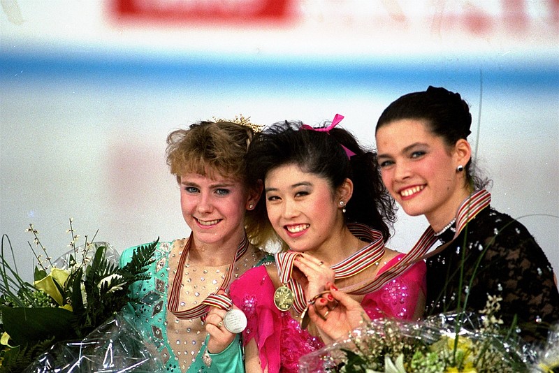 
              FILE - In this March 12, 1991, file photo, American skaters (L to R) Tonya Harding, silver; Kristi Yamaguchi, gold; and Nancy Kerrigan, bronze, display their medals after the finals of the World Figure Skating Championships in Munich. A run-of-the-mill good luck tweet from Yamaguchi to Kerrigan is drawing online attention. Yamaguchi tweeted a message to Kerrigan ahead of Kerrigan’s performance on Monday’s “Dancing with the Stars” March 20, 2017, and added “break a leg.” Kerrigan was hit in the leg before the 1994 Winter Olympics by a man hired by the ex-husband of Harding. Yamaguchi’s spokeswoman says “no ill will was intended.” (AP Photo/Diether Endlicher, File)
            