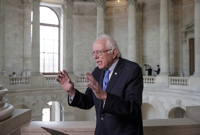 
              FILE - In this March 15, 2017, file photo, Sen. Bernie Sanders, I-Vt. gestures during a television interview on Capitol Hill in Washington. House Republicans’ health care bill provides massive tax cuts to the wealthy while increasing taxes for many lower income families, adding to America’s big income gap between the rich and everyone else. “This is a massive transfer of wealth from working families to the very richest people in this country,” said Sanders. “In this case, all the people will be forced to pay more for health insurance while billionaires get a tax break.” (AP Photo/J. Scott Applewhite, File)
            