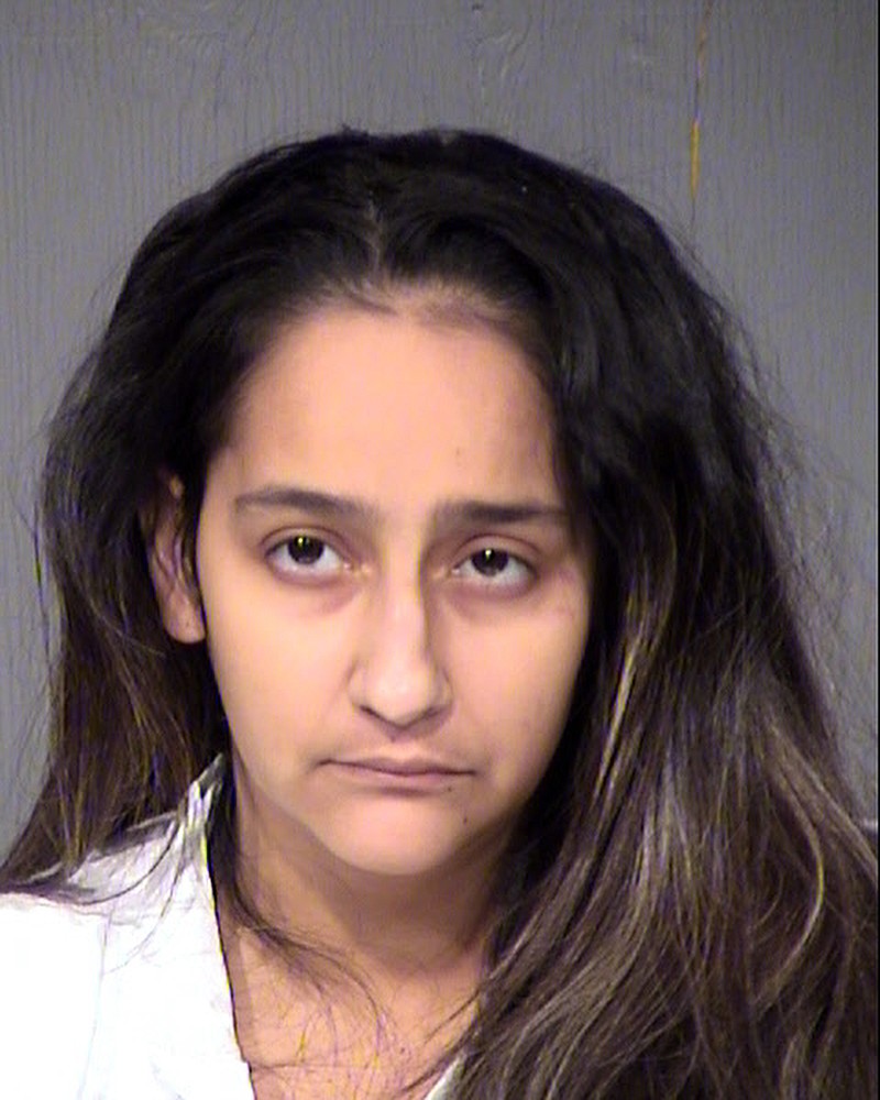 
              This undated booking photo provided by the Maricopa County Sheriff shows Wendy Lavarnia. Phoenix police say Lavarnia and her husband have been arrested following the shooting of their 9-year-old son, who police say remains on life support. Lavarnia told police she placed a loaded gun on a bed within reach of two of her young children while she turned to get a holster and that a 2-year-old shot the 9-year-old. She was arrested on suspicion of four counts of child abuse for allegedly endangering her children. (Maricopa County Sheriff via AP)
            
