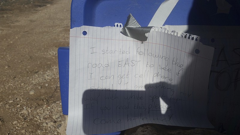 
              In this March 17, 2017, photo released by the Arizona Department of Public Safety shows a sign made by Amber VanHecke, who was stranded for five days near the Grand Canyon in Arizona. The 24-year-old Texas college student left signs on the car that ran out of gas detailing where she was headed in search of cell phone signal, and rescuers eventually found her. (Arizona Department of Public Safety via AP)
            