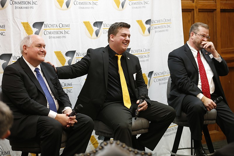 
              Libertarian candidate Chris Rockhold's campaign manager, Jordan Husted, center, jokes with Republican Ron Estes, left, about his attendance to debates as Democrat James Thompson looks on Thursday, March 23, 2017, before the start of a debate hosted by the Wichita Crime Commission. Thompson, Estes and Rockhold are running for the seat given up by Mike Pompeo when he became CIA Director. (Bo Rader/The Wichita Eagle via AP)
            