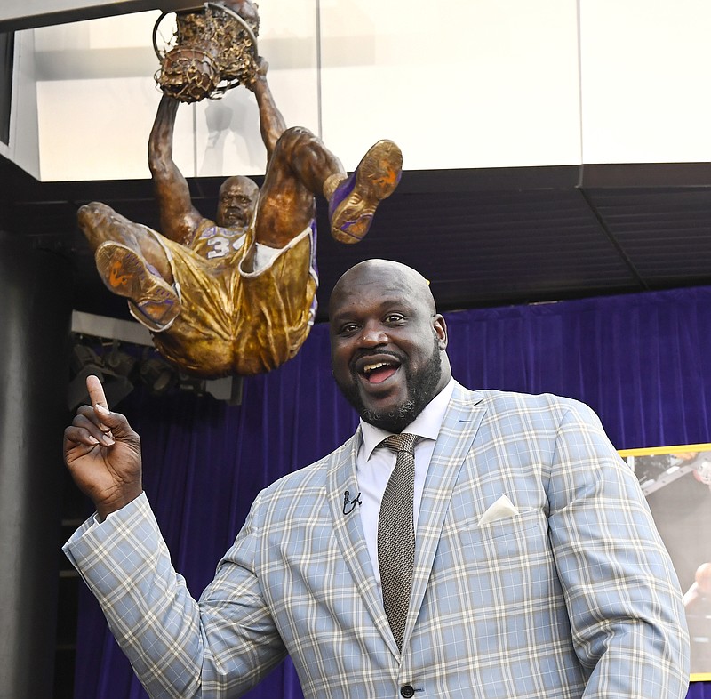 
              Shaquille O'Neal poses after the unveiling of his statue in front of Staples Center, Friday, March 24, 2017, in Los Angeles. (AP Photo/Mark J. Terrill)
            