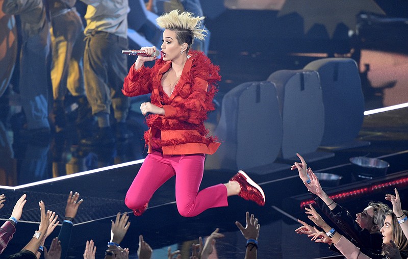 
              FILE - In this March 5, 2017 file photo, Katy Perry performs "Chained to the Rhythm" during the iHeartRadio Music Awards at the Forum in Inglewood, Calif.  Perry, Maroon 5 and One Direction’s Niall Horan are set to perform at the annual Wango Tango concert near Los Angeles in May. Ryan Seacrest and iHeartMedia’s KIIS FM made the announcement Friday, March 24.  (Photo by Chris Pizzello/Invision/AP)
            