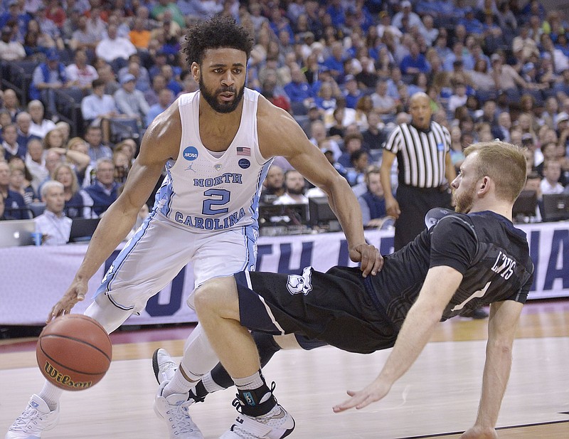 
              North Carolina guard Joel Berry II (2) moves past Butler guard Tyler Lewis in the first half of an NCAA college basketball tournament South Regional semifinal game Friday, March 24, 2017, in Memphis, Tenn. (AP Photo/Brandon Dill)
            