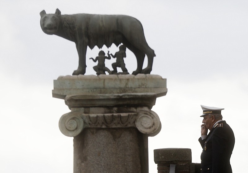 
              A local police officer smokes a cigarette at Rome's Capitol hill, Thursday, March 23, 2017.  The Rome's Capitol hill will host the celebrations for the 60th Anniversary of the 1957 Treaty of Rome.  (AP Photo/Gregorio Borgia)
            