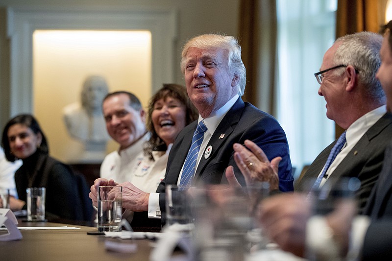 President Donald Trump meets with truckers and industry CEOs regarding healthcare, Thursday, March 23, 2017, in the Cabinet Room of the White House in Washington. (AP Photo/Andrew Harnik)