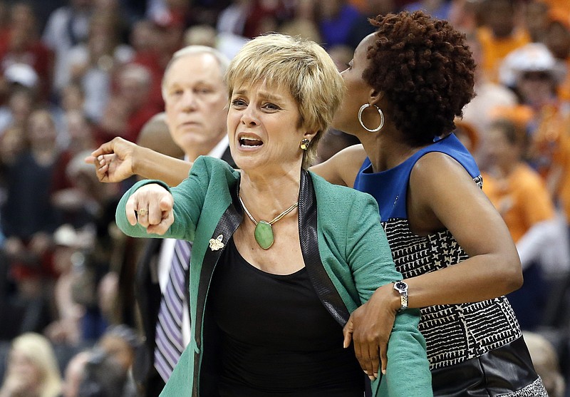 
              FILE - In this April 1, 2013, file photo, Baylor head coach Kim Mulkey gestures during the second half of a regional semi-final game against Louisville in the women's NCAA college basketball tournament in Oklahoma City. Baylor faces Louisville in the regional semifinals in a rematch of Louisville’s stunning regional semifinal upset of the defending national champion Bears in 2013. (AP Photo/Sue Ogrocki, File)
            