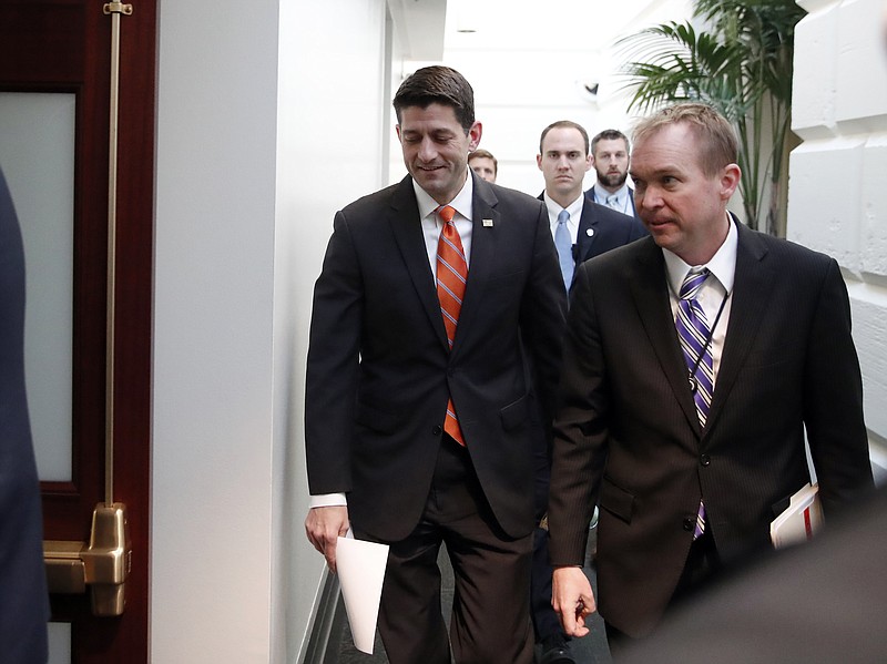 
              House Speaker Paul Ryan of Wis. left, and director of the Office of Management and Budget Mick Mulvaney arrive for a Republican caucus meeting on Capitol Hill, Thursday, March 23, 2017, in Washington. (AP Photo/Alex Brandon)
            