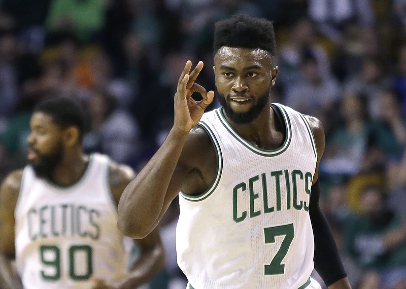 
              Boston Celtics forward Jaylen Brown (7) gestures after making a 3-point shot against the Phoenix Suns during the first quarter of an NBA basketball game, Friday, March 24, 2017, in Boston. (AP Photo/Elise Amendola)
            