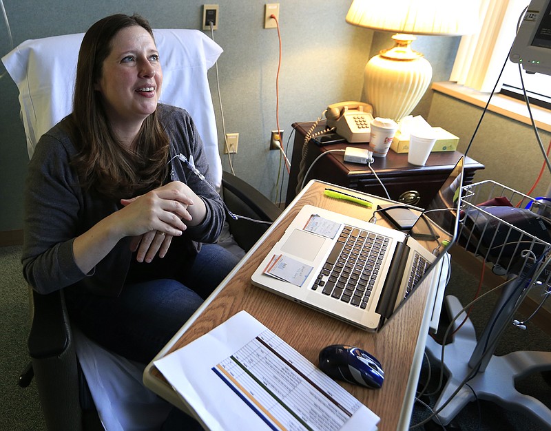 
              Janella Williams watches television for news on the healthcare vote while receiving treatment at Lawrence Memorial Hospital in Lawrence, Kan., Friday, March 24, 2017. The 45-year-old graphic designer receives medication from an intravenous drip for a neurological disorder, getting the drugs that she says allow her to walk. Under her Affordable Care Act plan, she pays $480 a month for coverage and has an out-of-pocket maximum of $3,500 a year. If she were to lose it, she wouldn’t be able to afford the $13,000-a-year out-of-pocket maximum under her husband’s insurance. Her treatments cost about $90,000 every seven weeks. (AP Photo/Orlin Wagner)
            