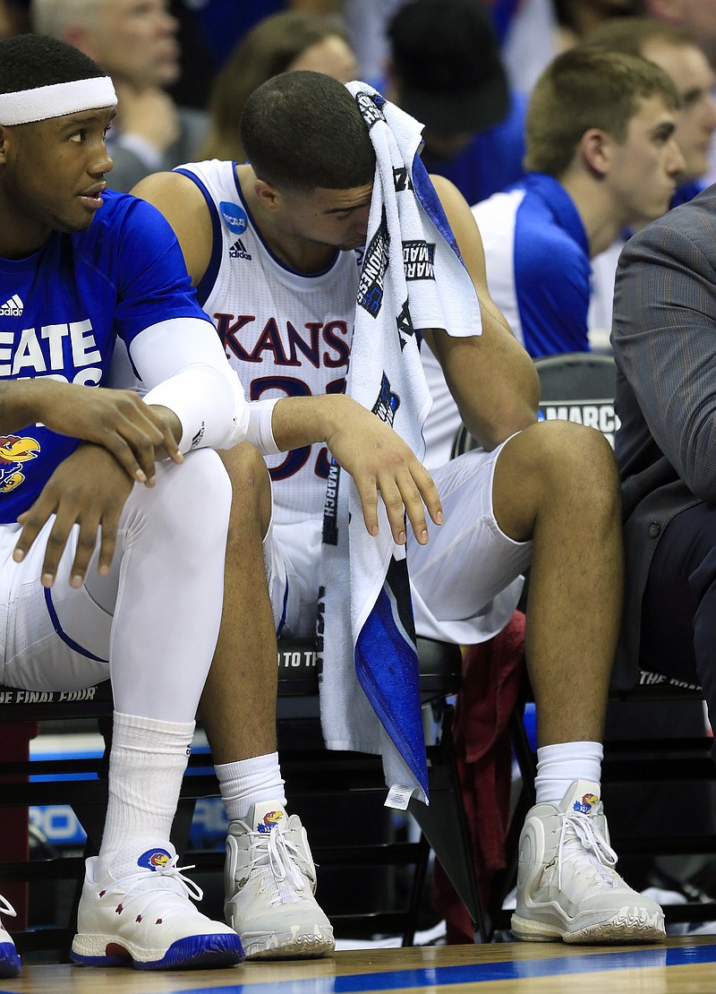 
              Kansas forward Landen Lucas sits on the bench during the second half of the team's Midwest Regional final against Oregon in the NCAA men's college basketball tournament, Saturday, March 25, 2017, in Kansas City, Mo. Oregon won 74-60. (AP Photo/Orlin Wagner)
            