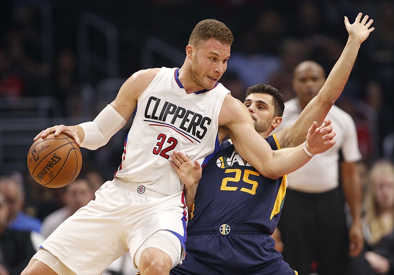 
              Los Angeles Clippers forward Blake Griffin, left, attempts to back down Utah Jazz guard Raul Neto, right, during the first half of an NBA basketball game, Saturday, March 25, 2017, in Los Angeles. (AP Photo/Danny Moloshok)
            
