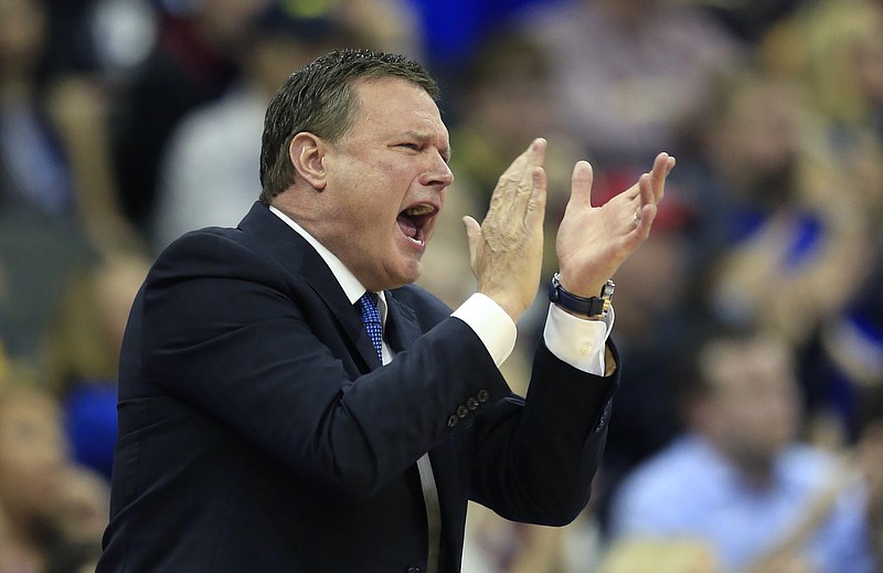 
              Kansas coach Bill Self applauds his team during the first half of a regional semifinal against Purdue in the NCAA men's college basketball tournament, Thursday, March 23, 2017, in Kansas City, Mo. (AP Photo/Orlin Wagner)
            