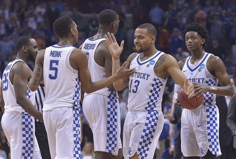 
              Members of the Kentucky team celebrate after an NCAA college basketball tournament South Regional semifinal game against UCLA, Friday, March 24, 2017, in Memphis, Tenn. Kentucky won 86-75. (AP Photo/Brandon Dill)
            