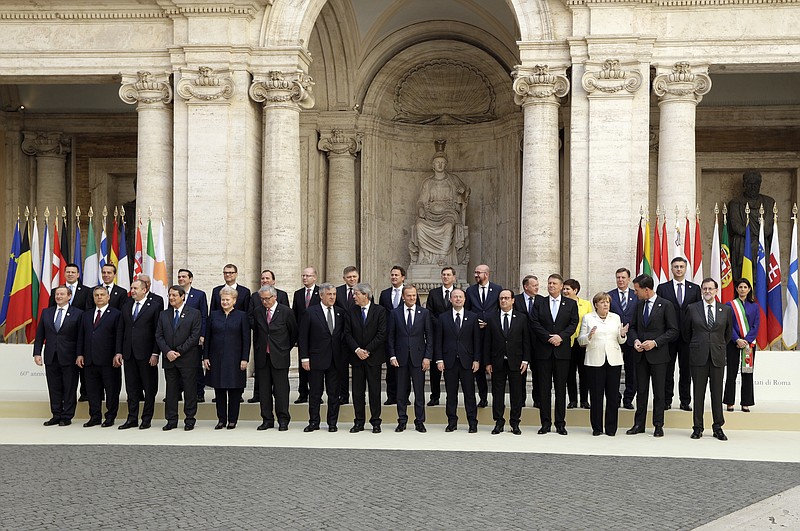 
              European Union heads of state pose for a group photo in the Cortile di Michelangelo during an EU summit in Rome on Saturday, March 25, 2017. EU leaders were gathering in Rome to mark the 60th anniversary of their founding treaty and chart a way ahead following the decision of Britain to leave the 28-nation bloc. (AP Photo/Andrew Medichini)
            