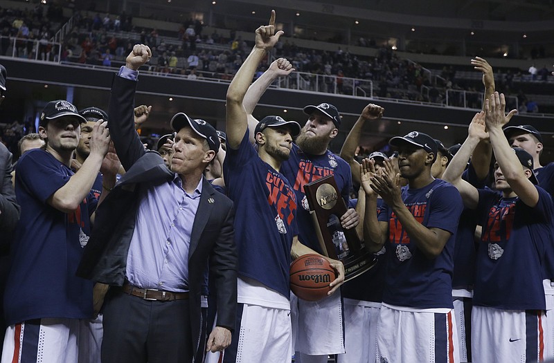 
              Gonzaga players and head coach Mark Few, second from left, celebrate after beating Xavier during an NCAA Tournament college basketball regional final game Saturday, March 25, 2017, in San Jose, Calif. (AP Photo/Ben Margot)
            