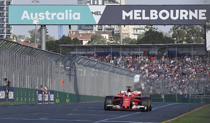 
              Ferrari driver Sebastian Vettel of Germany steers his car during the Australian Formula One Grand Prix in Melbourne, Australia, Sunday, March 26, 2017. (AP Photo/Andy Brownbill)
            