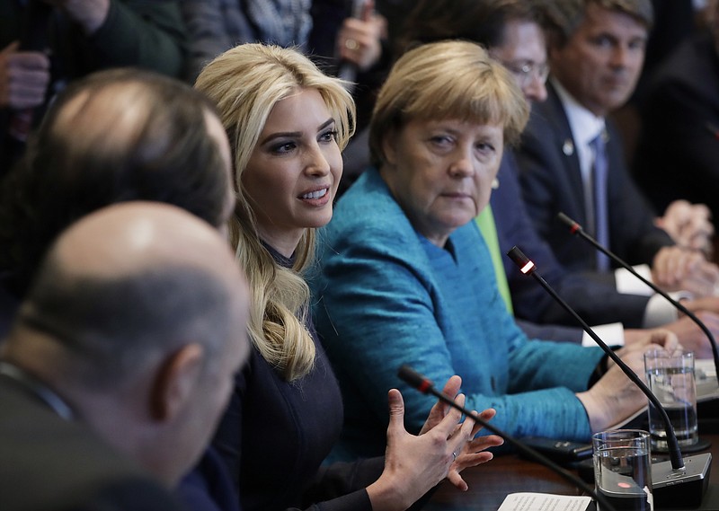 
              In this Friday, March 17, 2017, photo, German Chancellor Angela Merkel listens as Ivanka Trump speaks during a meeting with President Donald Trump at the White House in Washington. Ivanka Trump is planning a trip to Germany to attend a summit on the economic empowerment of women, a senior administration official said Sunday, March 26. (AP Photo/Evan Vucci)
            