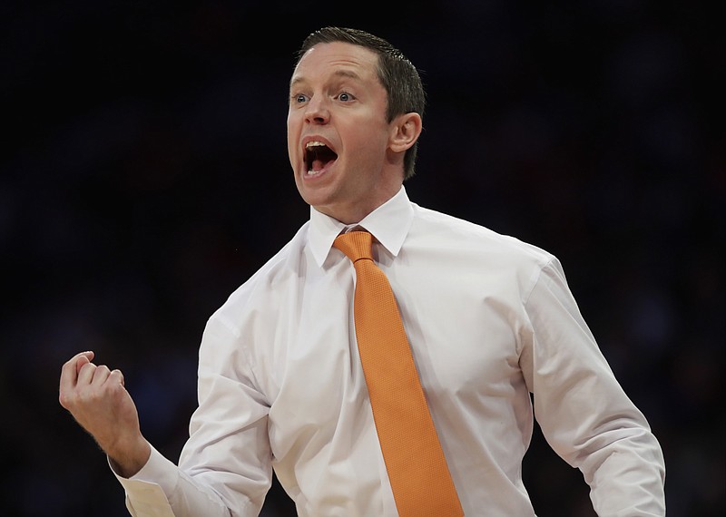 
              Florida head coach Mike White reacts in the first half against Wisconsin during an East Regional semifinal game of the NCAA men's college basketball tournament, Friday, March 24, 2017, in New York. (AP Photo/Frank Franklin II)
            