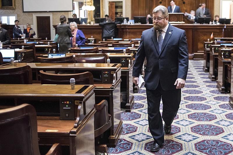 
              In this Jan. 10, 2017 file photo, Rep. Eric Bedingfield, R-Greenville, walks through the House chamber during the first day of legislative session at the South Carolina Statehouse in Columbia, S.C. Bedingfield once shunned marijuana use, but when his eldest son died of an overdose last Easter, ending a six-year struggle with opioid addiction, the conservative Republican co-sponsored this year's medical cannabis legislation. (AP Photo/Sean Rayford, File)
            