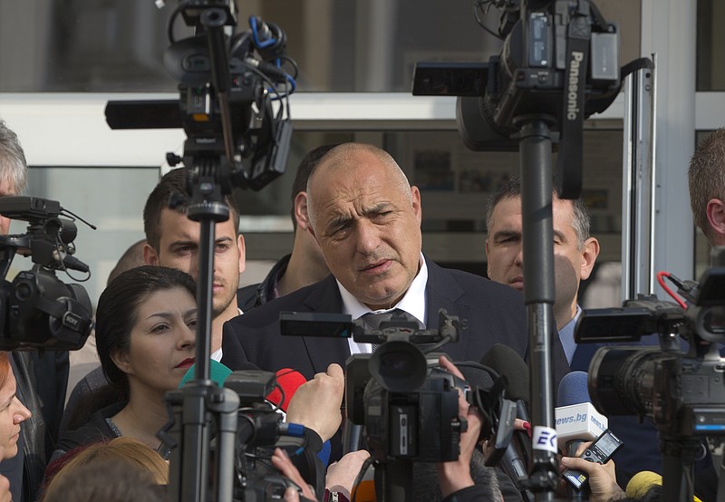 
              Bulgarian ex-Premier Boiko Borisov, leader of the center-right GERB party, speaks to media after voting, in Sofia, Bulgaria, Sunday, March 26, 2017. Bulgarians are heading to the polls for the third time in four years in a snap vote that could tilt the European Union's poorest member country closer to Russia as surveys put the center-right GERB party neck-and-neck with the Socialist Party. (AP Photo/Vadim Ghirda)
            