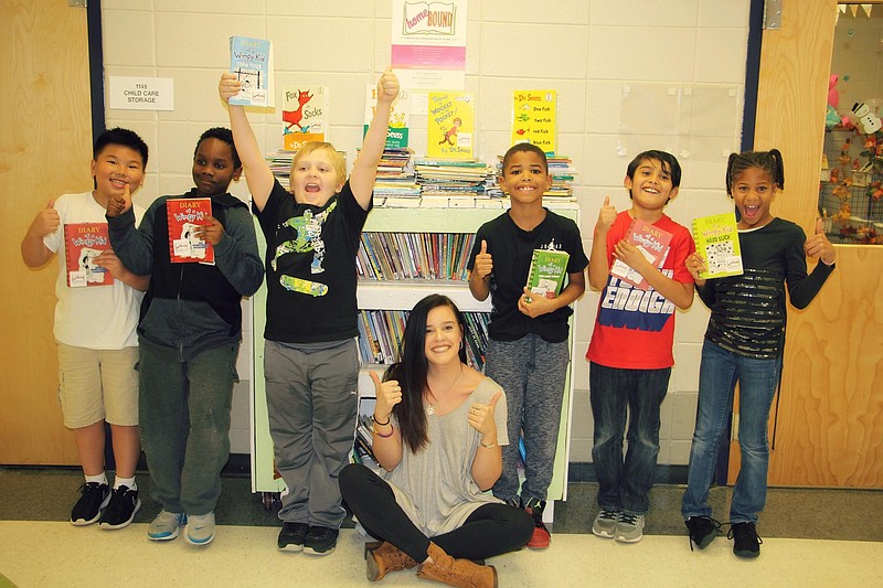 East Ridge Elementary students Jaelyn, Josh, Boeyden, Malachi, Johnny and Makayla, from left, stand with HomeBound founder Kelsey Butler.