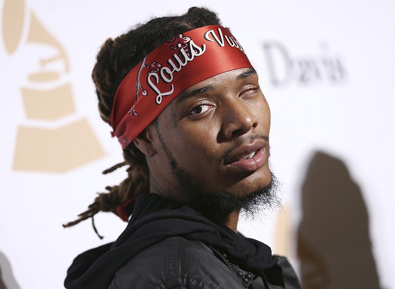 
              FILE - In this Feb. 14, 2016, file photo, Fetty Wap arrives at the 2016 Clive Davis Pre-Grammy Gala at the Beverly Hilton Hotel in Beverly Hills, Calif. Authorities have made an arrest stemming from a Sunday, March 26, 2017, shooting involving hip-hop star Fetty Wap in his New Jersey hometown of Paterson, leaving several people wounded. Investigators said the rapper and several friends became involved in a heated altercation with another group. Officials said the rapper was not hurt. (Photo by John Salangsang/Invision/AP, File)
            