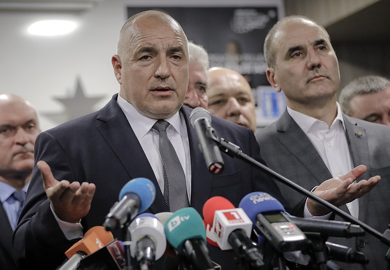 
              Bulgarian ex-Premier Boiko Borisov, leader of the center-right GERB party, gestures during a statement at the party's headquarters, in Sofia, Bulgaria, Sunday, March 26, 2017. Bulgaria's center-right GERB party of former Prime Minister Boiko Borisov leads by 4 percent in Sunday's parliamentary elections , according to two separate exit polls conducted by the Alpha Research and the Gallup International Bulgaria polling agencies. (AP Photo/Vadim Ghirda)
            
