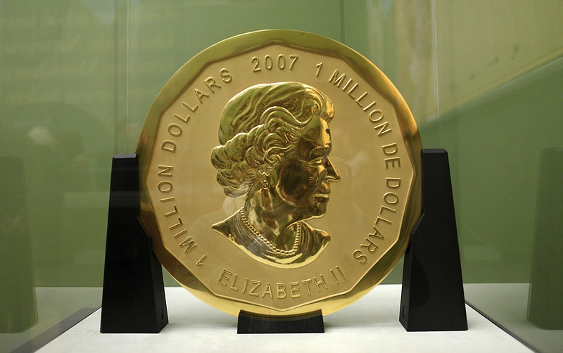 
              FILE - The Dec. 12, 2010 file photo shows the gold coin 'Big Maple Leaf' in the Bode Museum in Berlin. The 100-kilogram (220 pound) gold coin disappeared from the museum. (Marcel Mettelsiefen/dpa via AP)
            