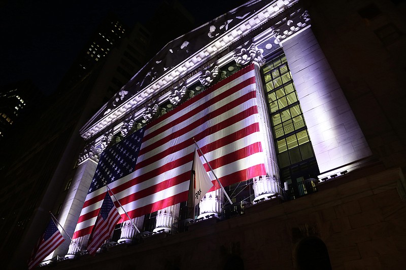 
              FILE - In this Friday, Feb. 17, 2017, file photo, an American flag hangs on the front of the New York Stock Exchange. Stocks around the world sank Monday, March 27, 2017, on worries that the Trump White House may not be able to help businesses as much as once thought. Many of the trends that have been in place since Election Day went into sharp reverse: The dollar’s value sank against other currencies, as did bank stocks, while prices jumped for Treasury bonds. (AP Photo/Peter Morgan, File)
            