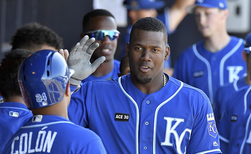 
              Kansas City Royals' Jorge Soler is congratulated after his two-run home run in the ninth inning of a spring training baseball game against the Seattle Mariners in Peoria, Ariz., Friday, March 24, 2017. (John Sleezer/The Kansas City Star via AP)
            