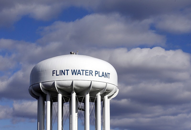 
              FILE - In this March 21, 2016 file photo, the Flint Water Plant water tower is seen in Flint, Mich. The U.S. Environmental Protection Agency said on March 27, 2017, that a $100 million grant to address drinking water issues in the city was approved after a formal application from Michigan state officials. (AP Photo/Carlos Osorio, File)
            