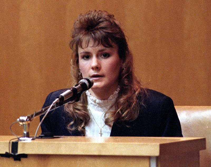 
              FILE - In a Monday, March 18, 1991 file photo, Pamela Smart answers questions from the defense in her murder conspiracy trial in Rockingham County Superior Court in Exeter, N.H. Advocates for Pamela Smart, who’s serving a life sentence for plotting with her teenage lover to kill her husband, say they are planning to file a petition seeking a reduced sentence.  (AP Photo/Jon Pierre Lasseigne, File)
            