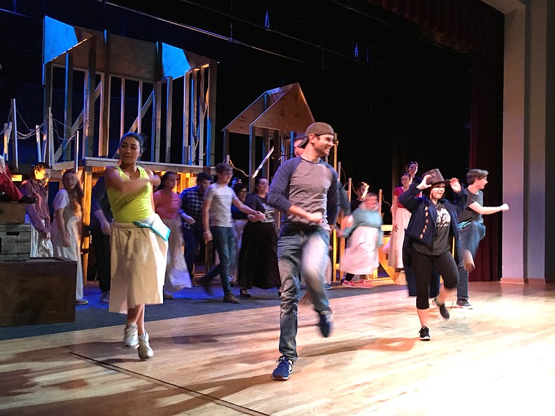 Artful Dodger, played by Marybeth Davis, second from right, leads a production number in "Oliver!"