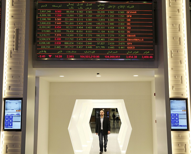 
              A stock ticker displays the share price and trade volume of Emaar Malls and others stock at the Dubai Financial Market in Dubai, United Arab Emirates, Monday, March 27, 2017. Dubai's Emaar Malls, a subsidiary of the state-backed construction firm Emaar, said Monday it made an $880-million offer to buy the online retailer Souq.com amid rumors of a possible acquisition of the firm by Amazon. (AP Photo/Jon Gambrell)
            