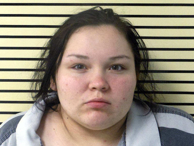 
              This photo provided by the Wagoner County Sheriff's Office shows Elizabeth Marie Rodriguez, of Oolagah, Okla. Police say Rodriguez, a woman suspected of driving three men to what Oklahoma authorities say was a home invasion in the Tulsa, Okla. suburb of Broken Arrow on Monday, March 27, 2017, that left the men shot to death by the homeowner's son, has been arrested on murder and burglary warrants. (Wagoner County Sheriff's Office via AP)
            