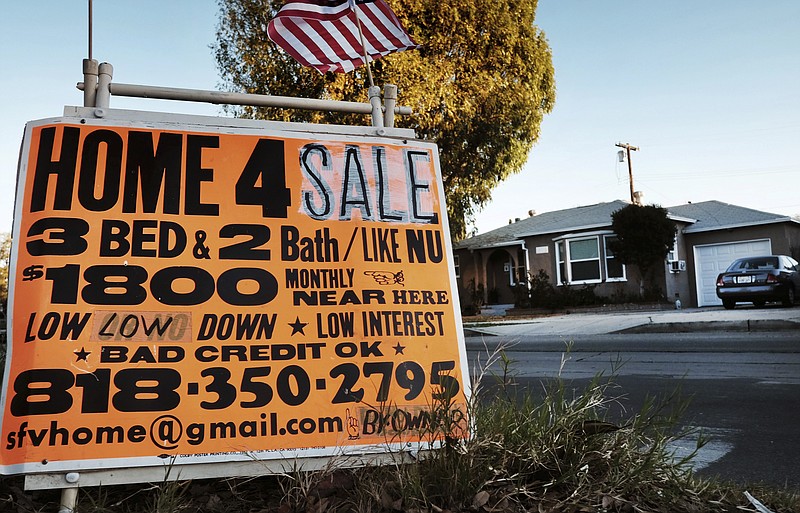 
              FILE - This Saturday, Jan. 17, 2015, file photo shows a sign advertising a house for sale in Los Angeles. U.S. home prices jumped in January 2017 from a year earlier at the fastest pace in nearly 2 1/2 years, as a tight supply of houses for sale spurred bidding wars in many cities. The Standard & Poor's CoreLogic Case-Shiller 20-city home price index, released Tuesday, March 28, 2017, increased 5.7 percent in January, the most since July 2014. (AP Photo/Richard Vogel, File)
            