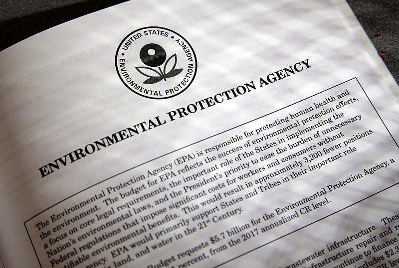 
              FILE - In this March 16, 2017, file photo, proposals for the Environmental Protection Agency (EPA) in President Donald Trump's first budget are displayed at the Government Printing Office in Washington. President Donald Trump will sign an executive order on March 29 that will suspend, rescind, or flag for review more than half-a-dozen measures that were part of former President Barack Obama’s sweeping plan to curb global warming. (AP Photo/J. Scott Applewhite, file)
            