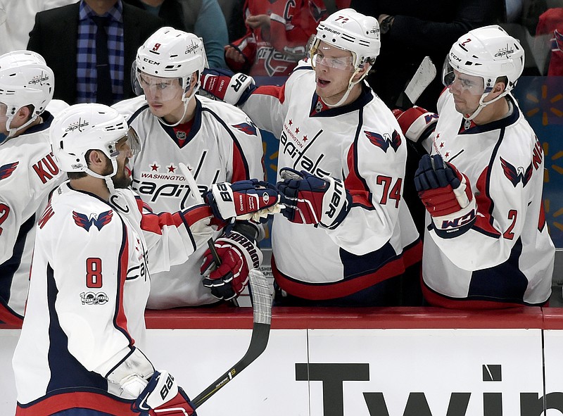 
              Washington Capitals left wing Alex Ovechkin (8), of Russia, is congratulated by Dmitry Orlov (9), of Russia, John Carlson (74) and Matt Niskanen (2) on scoring a goal against the Minnesota Wild on the power play during the second period of an NHL hockey game, Tuesday, March 28, 2017, in St. Paul, Minn. (AP Photo/Hannah Foslien)
            