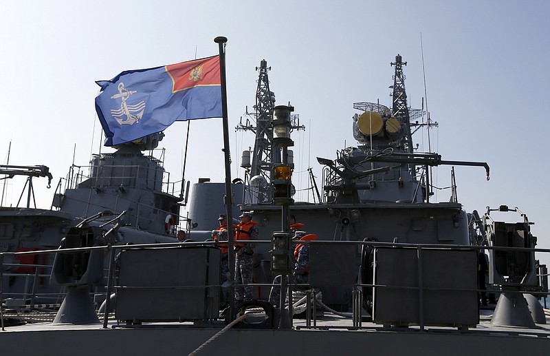 
              FILE - In this March 15, 2017, file photo, Montenegrin sailors stand at the light frigate "Kotor" in the harbour of Bar, Montenegro. Montenegro is set to become NATO’s newest member after the Senate voted overwhelmingly March 28 to ratify the tiny Balkan nation’s entry into the alliance. Despite its size, Montenegro bears strategic importance. A former ally of Russia, the country is in the midst of a clash between the West and Moscow over influence in the Balkans. Montenegro will become the 29th member of the alliance and its admission gives NATO a contiguous border along the Adriatic coast. (AP Photo/Darko Vojinovic)
            
