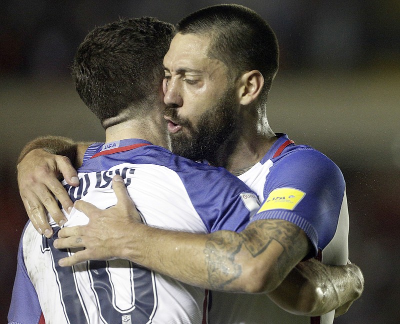
              United States' Christian Pulisic, left, celebrates with teammate United States' Clint Dempsey after he scored against Panama during a a 2018 World Cup qualifying soccer match in Panama City, Tuesday, March 28, 2017. (AP Photo/Arnulfo Franco)
            