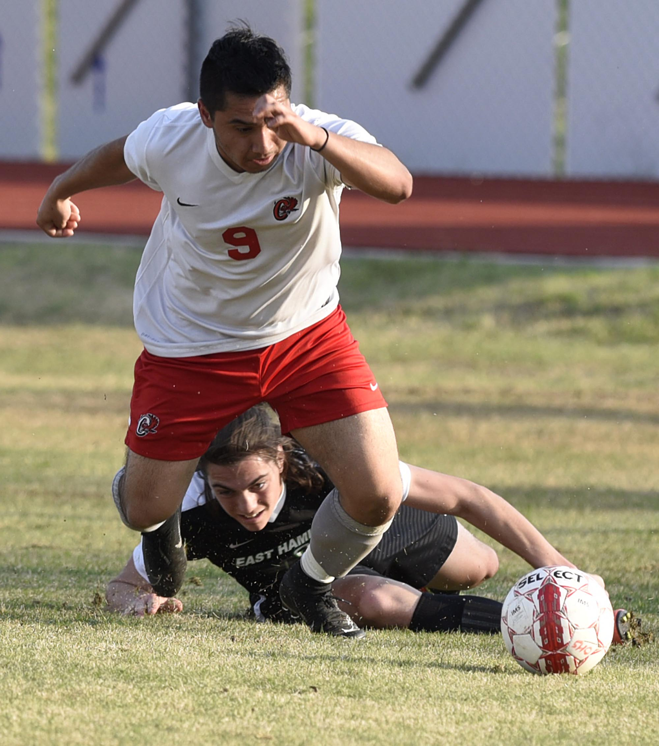 Ooltewah's Roberto Baza (9) heads toward the ball after he and East Hamilton's Mason LaFollete (6) collided. The East Hamilton Hurricanes visited the Ooltewah Owls in boys TSSAA soccer action on March 29, 2017.